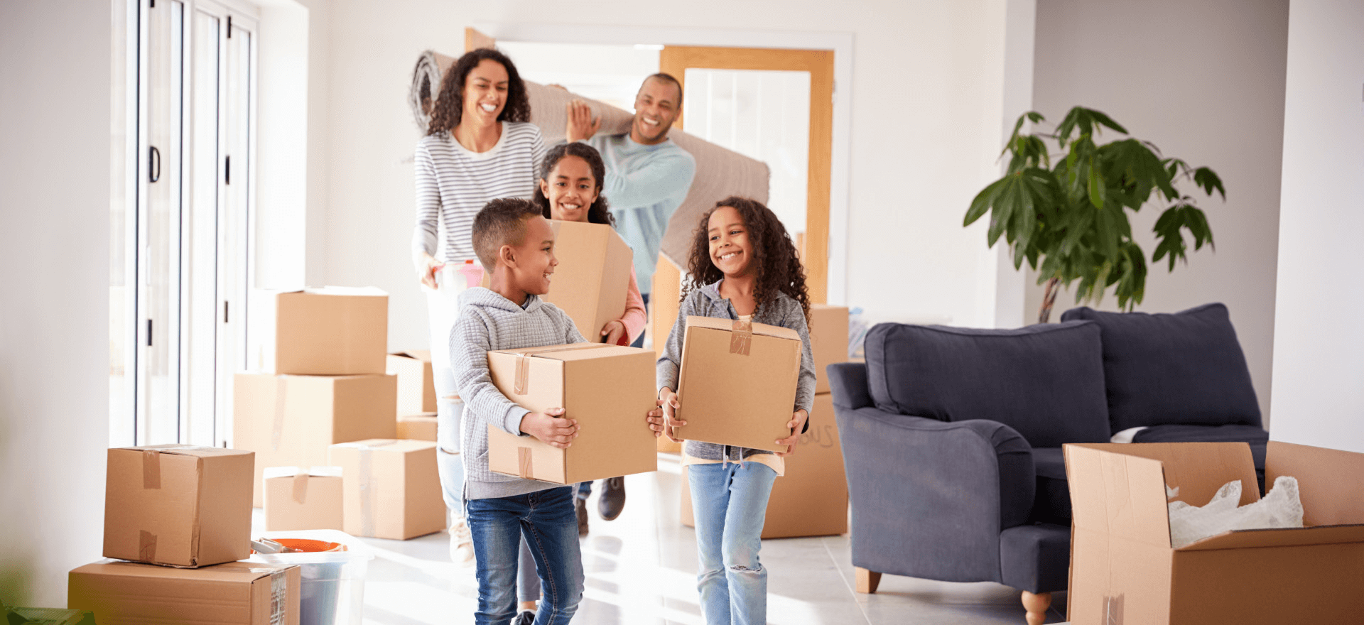 Happy family moving in to their new home thanks to Cornerstone Residential Lending Solutions, LLC.