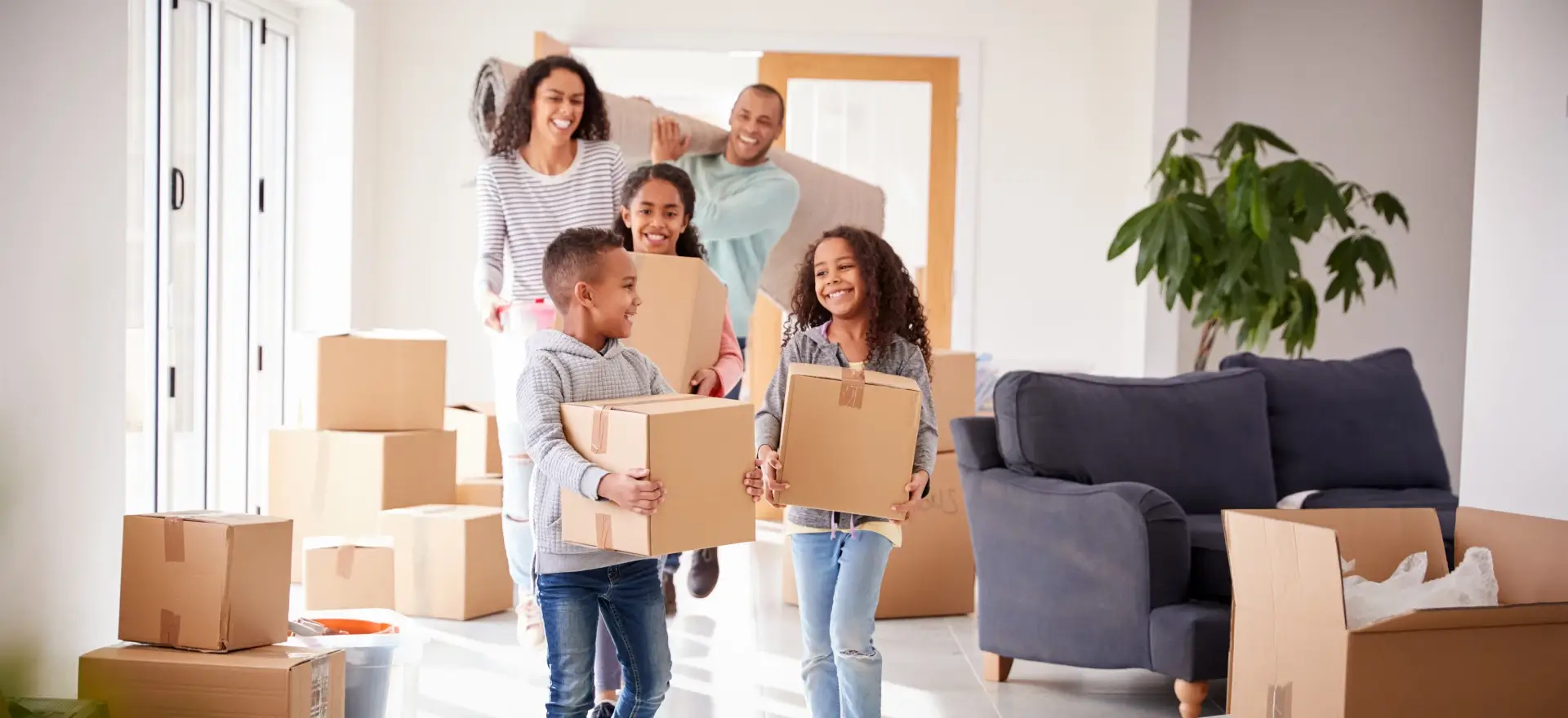 Happy family moving in to their new home thanks to Cornerstone Residential Lending Solutions, LLC.